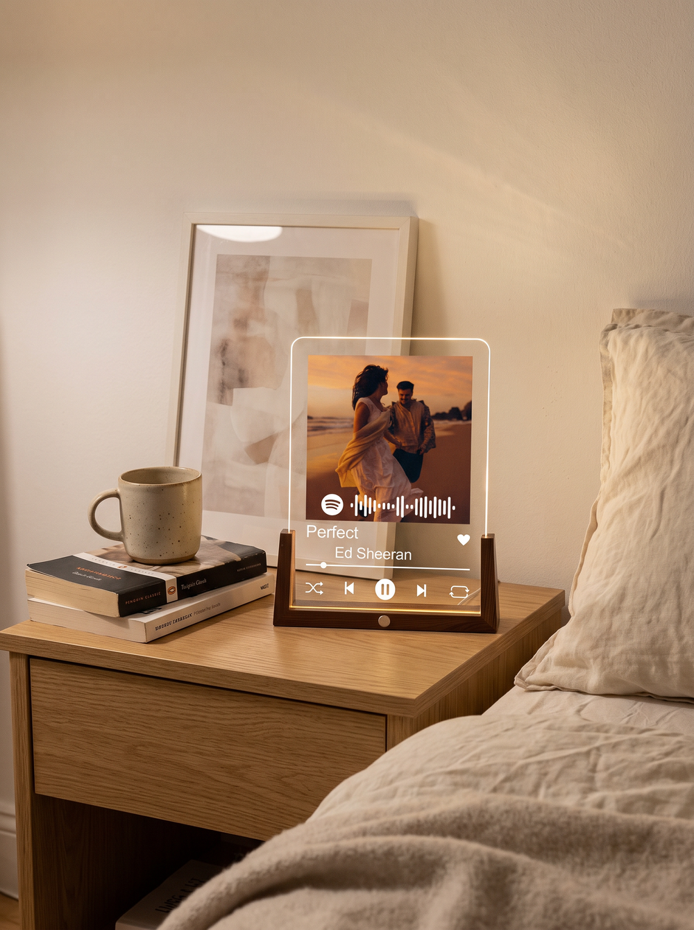 A custom song plaque with a photo on an LED base