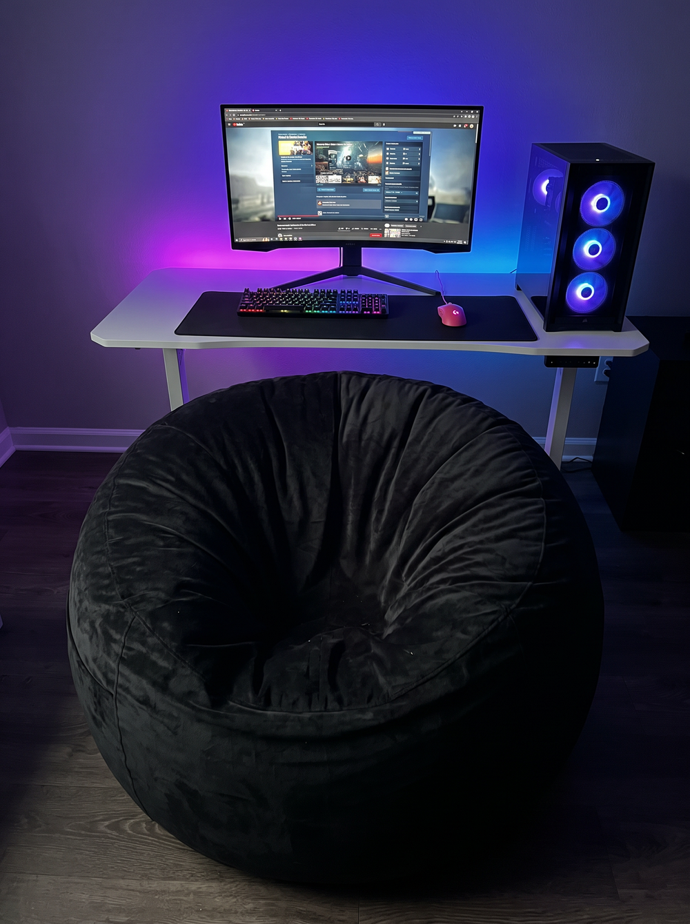 A black memory foam bean bag chair in a living room